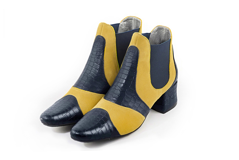 Women's navy blue and yellow elegant two-tone Chelsea ankle boots, with side elastics. Round toe. Low flare heels - Front view